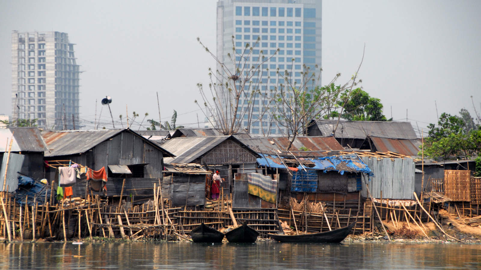 high-rise buildings and informal settlements in Dhaka